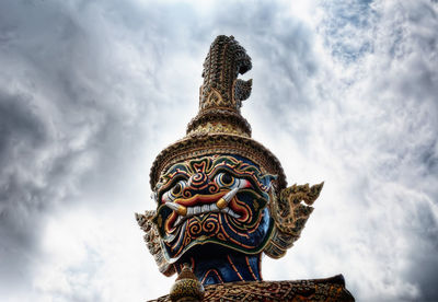 Low angle view of statue against sky