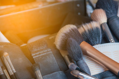 Close-up of make-up brushes on table