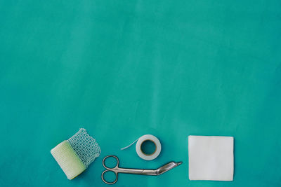 High angle view of paper on blue table