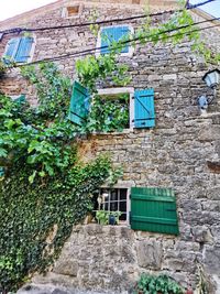 Low angle view of stone wall of old building