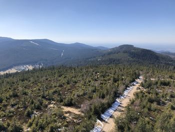 High angle view of trees and mountains against sky