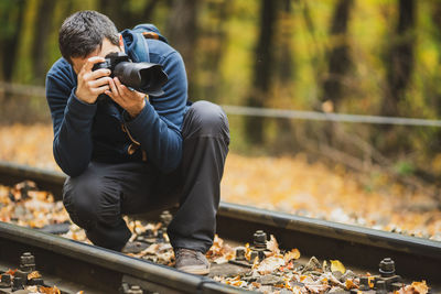 Full length of man photographing