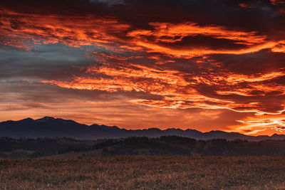 Scenic view of landscape against sky during sunset