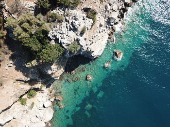 High angle view of rock formation in sea