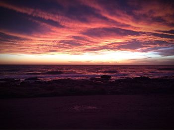 Scenic view of sea against dramatic sky