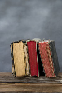 Close-up of ancient books on wooden table