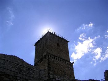 Low angle view of built structure against blue sky