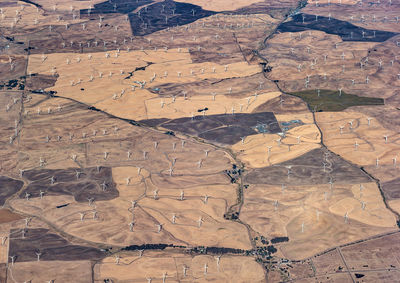 Aerial view of a rural landscape and wind farm