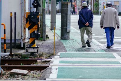 People walking on street in city