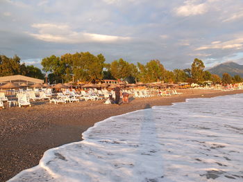 Scenic view of beach against sky in city