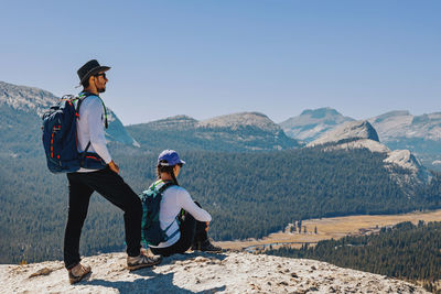 Man and woman on the top of the mountain. hiking, outdoor adventure.