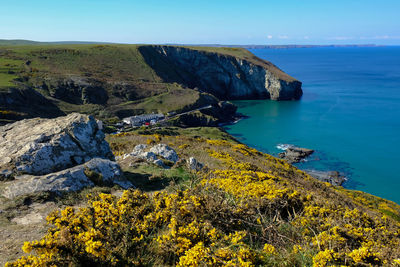 Scenic view of rock formation in sea against sky