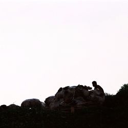 Low angle view of rocks against clear sky