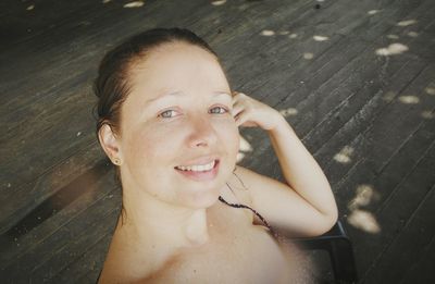 High angle portrait of shirtless boy smiling