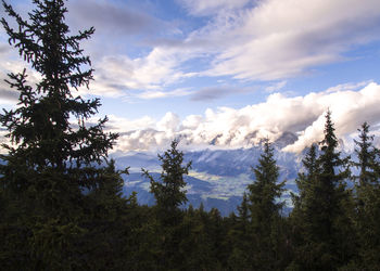 Scenic view of mountains against cloudy sky