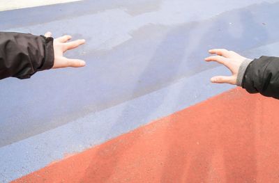 High angle view of people hand on street