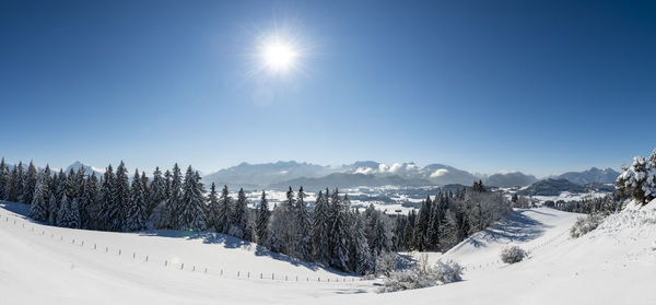 Scenic view of snow covered mountains against sky