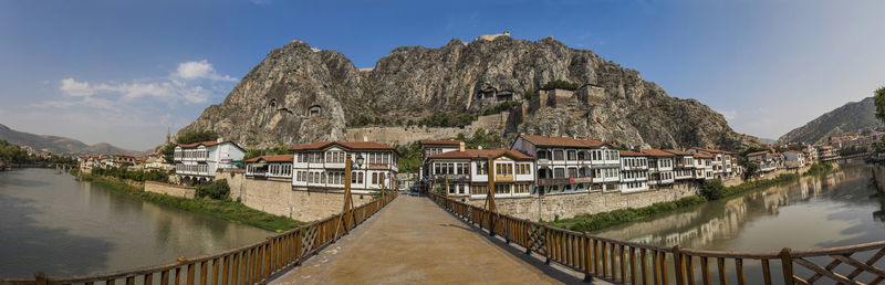 Panoramic view of river and houses against sky
