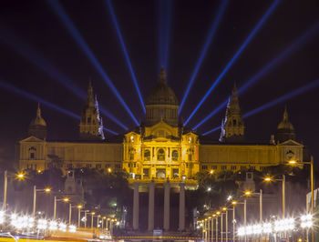Illuminated buildings in city at night