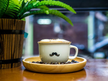 Close-up of coffee cup on table