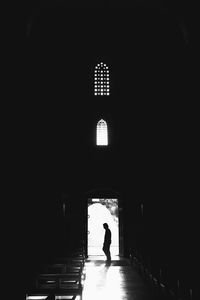 Silhouette man in corridor of building