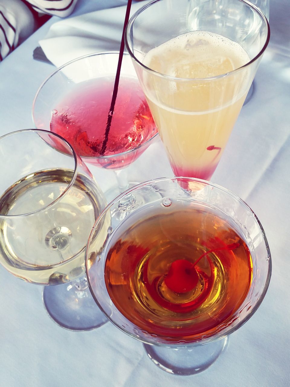 drink, food and drink, refreshment, drinking glass, freshness, indoors, table, still life, glass - material, close-up, alcohol, high angle view, transparent, frothy drink, glass, wineglass, serving size, no people, juice, ice cube