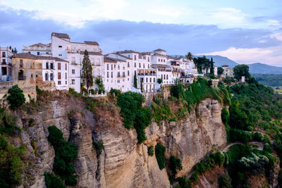 Panoramic view of buildings in city against sky