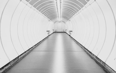 Empty illuminated subway tunnel