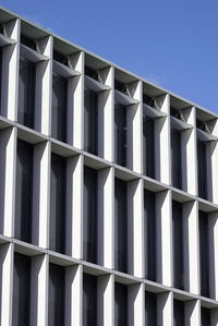 Low angle view of building against clear blue sky