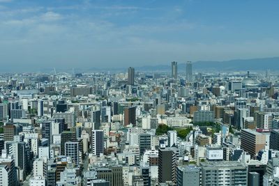 Aerial view of cityscape against sky