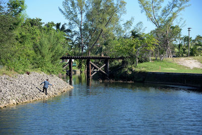 Scenic view of bridge over river against sky