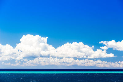 Scenic view of sea against blue sky