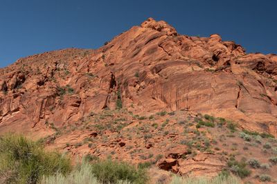 Rock formations on landscape against clear sky