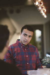 Businessman looking at colleague in meeting