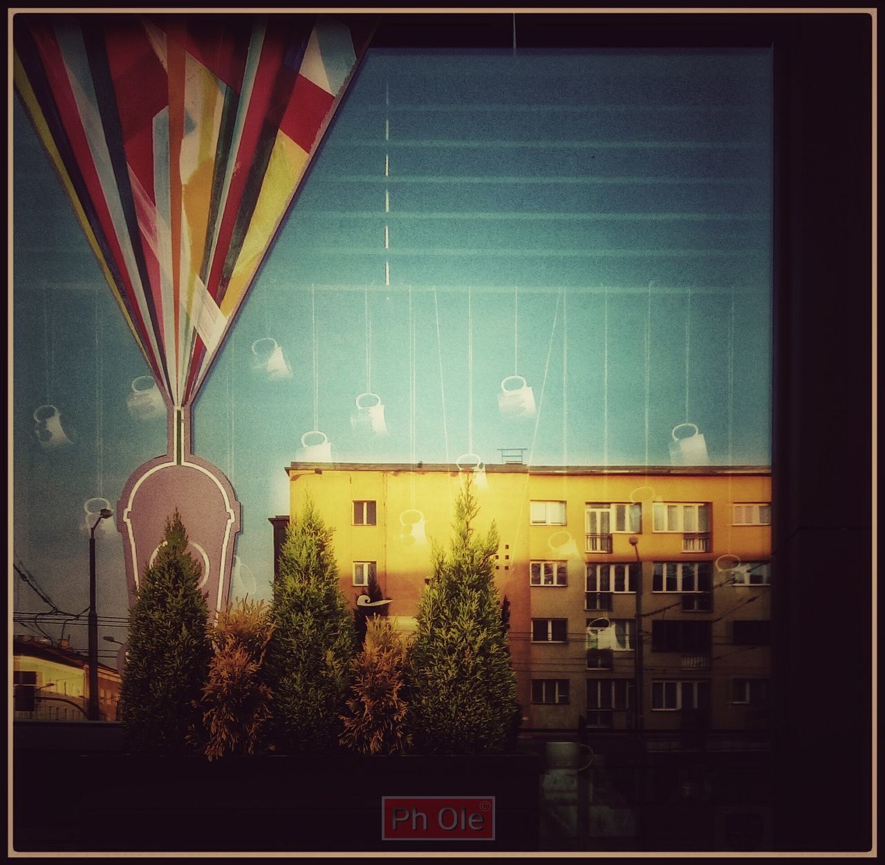 ILLUMINATED BUILDING AGAINST SKY IN CITY