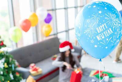 Low section of woman with balloons