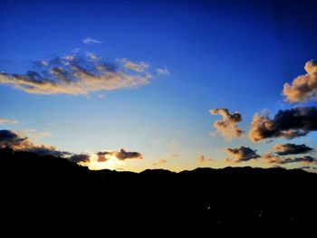 Low angle view of silhouette landscape against sky during sunset