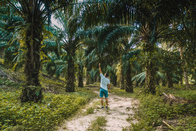 Woman walking in forest