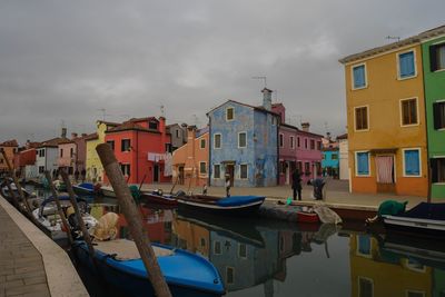 Boats moored at harbor