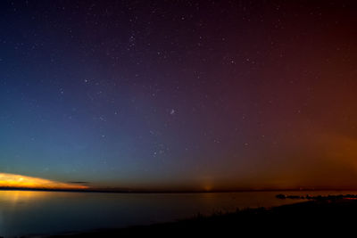 Scenic view of sea against sky at night