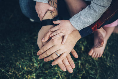 Midsection of couple hands