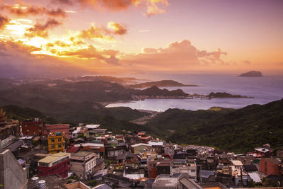 High angle view of townscape against sky during sunset