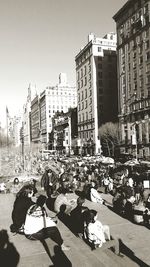 People in city against clear sky