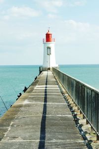 Pier on sea against sky