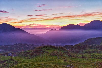 Scenic view of mountains against sky during sunset