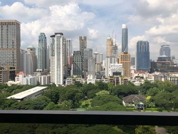 Modern buildings in city against sky