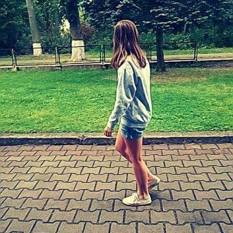 tree, lifestyles, park - man made space, casual clothing, standing, leisure activity, full length, low section, sunlight, person, grass, day, young women, young adult, dress, footpath, outdoors, long hair