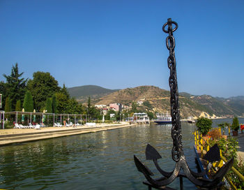 Scenic view of lake against clear blue sky