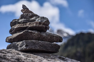 Low angle view of stack of rock against sky