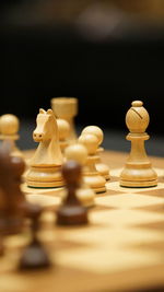 Close-up of chess pieces against black background